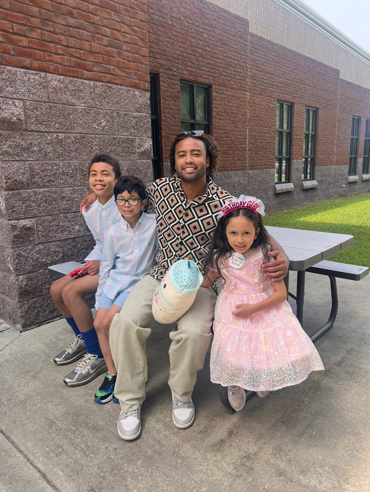 Jimmy Thomas, known to his family as Om Jimmy, with his nephews and niece